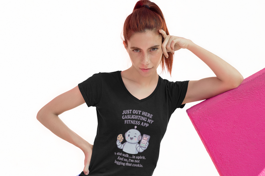 “Just Out Here Gaslighting My Fitness App” I did walk… in spirit. And no, I'm not logging that cookie....Ladies' V-Neck Tee